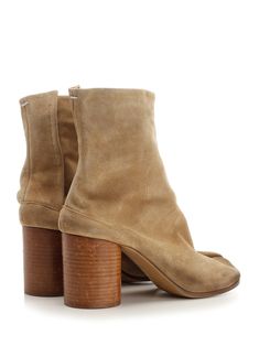 Sand beige suede 'Tabi' ankle boot from Maison Margiela, with cylindrical wooden heel and hidden hook closure. Composition: T1 100% PBV - T2 100% PVN - T3 100% PVN - T4 100% PBV - T5 100% EL | Maison Margiela Women's tabi Suede Ankle Boot in Medal Bronze | SS24 Tabi Boots, Haute Couture Designers, Maison Margiela Tabi, Margiela Tabi, Margiela Shoes, Zegna Shoes, Androgynous Fashion, Wooden Heel, Brown Ankle Boots