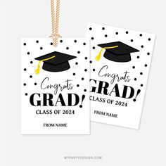 two graduation tags with black and white polka dots