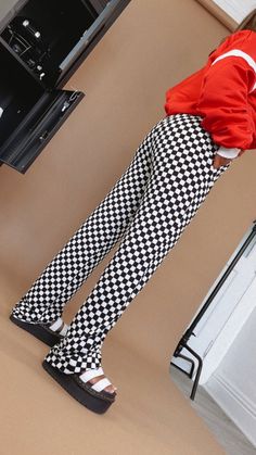 PREORDER shipping 10.1.24  Kickin' it and turning heads, this checkered pant is featured in a, relaxed high stretch fit with a black/white checkered pattern and high rise waistband for a true cool girl energy look. Checkered Pants Waistband: Elastic Fabric: 95% Polyester, 5% Spandex Elastic waistband High stretch fabrication Pockets Wide leg bottom Imported Fit: True to size! Measurements:  S: INSEAM: 32" | 13-18” WAIST | 12” RISE Model Specs: Karli is wearing a size small in the photo. How will this item fit you? Check out our MODEL SPECS (Typical Sizing - Karli: S-Size 5/26 - 5ft 2in, Emily: S-Size 3/25 - 5ft 5in, Syd: L/XL- Size 15/ - 5ft 8in)Need help with sizing? No problem! Join our VIP group on Facebook, Everyday Chic Boutique VIP Insiders to chat directly with our team and other c Girl Energy, Black White Checkered, Checkered Pants, Everyday Chic, Elastic Fabric, Pants Pattern, Checkered Pattern, Chic Boutique, White Patterns