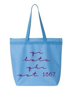 a blue tote bag with writing on the front and bottom, in red ink