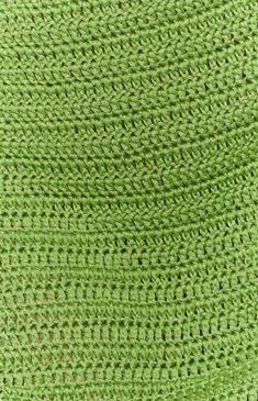 a close up view of a green crocheted material