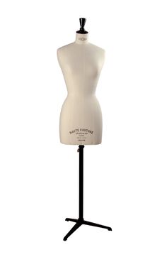 a white mannequin on a black stand