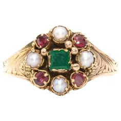 An antique emerald, garnet, pearl, and yellow gold ring, comprising one square shaped emerald, four round cut garnets, and four half pearls, set in 15 karat yellow gold, to a band of 15 karat yellow gold. This lovely ring is set to the centre with a deep green emerald, which is in lovely condition. The verdant emerald is square cut and surrounded by a cluster of shimmering seed pearls and burgundy garnets. The round cut garnets are well matched with one another, as are the lustrous seed pearls. Victorian Gemstone Cluster Ring, Victorian Ruby Cluster Ring With Gemstones, Victorian Gold Pearl Ring With Gemstone, Vintage Red Garnet Cluster Ring, Victorian Ruby Ring With Multi-stone In Gold, Pearl Cluster Ring, Seed Pearl Ring, Shiny Objects, Pearl Cluster