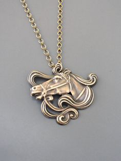 "Vintage Jewelry - Art Nouveau Necklace - Vintage Necklace - Brass Necklace - Horse Necklace - Chloe's Vintage handmade jewelry This is such a cool vintage necklace! A brass Art Nouveau design of a horse hangs from a pretty vintage brass ladder chain. Chloe says, \"Wear it and feel fabulous!\" This pendant is 1 1/2\" wide and 1 1/4\" tall Thanks for visiting Chloe's" Antique Nickel-free Jewelry For Jewelry Making, Vintage Bronze Jewelry For Crafting, Nickel-free Victorian Sterling Silver Necklaces, Victorian Sterling Silver Nickel-free Necklace, Nickel-free Gold Art Nouveau Jewelry, Victorian Sterling Silver Necklace, Nickel-free Victorian Sterling Silver Necklace, Gold Nickel-free Art Nouveau Jewelry, Vintage Round Pendant Jewelry For Crafting