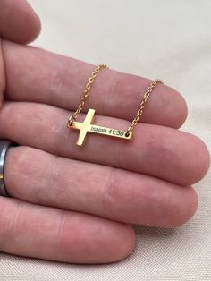 Our new personalized bible verse cross necklace for women.  A stunning and meaningful piece of jewelry designed to empower and inspire women in their faith journey!  This necklace combines contemporary style with timeless scripture, creating a powerful symbol of devotion and strength.  We take a double-mirrored finish cross pendant & professionally engrave your favorite bible verse, name, date, etc.   100% surgical stainless steel - no tarnishing or fading! * cross pendant is 25x14mm. <> 1. CUST Inspirational Gold Cross Jewelry, Personalized Crucifix Cross Necklace, Personalized Cross Jewelry For Everyday Wear, Minimalist Personalized Cross Pendant Necklace, Personalized Everyday Cross Jewelry, Inspirational Gold Cross Necklace, Bible Jewelry, Cross Necklace For Women, Bible Verse Necklace