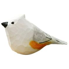 a white bird with an orange beak is sitting on top of a piece of paper