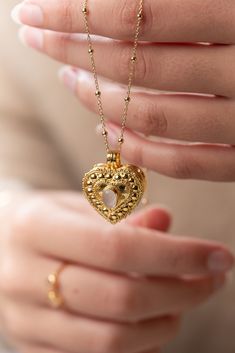 The Wishing Locket Collection is made up of beautiful handcrafted gold vermeil lockets, suspended on gold vermeil chains.  Each Wishing Locket can be filled with a personalised note - a wish, affirmation, vow, mantra, prayer or even a secret message from a loved one. Ever-present, the wearer holds the locket close to their heart. Choose from a selection of messages, or place something of your own in the locket of your choosing. We love the idea that putting a message out into the universe will h Gold Heirloom Jewelry With Heart Charm, Heirloom Gold Jewelry With Heart Charm, Dainty Gold-plated Locket Necklace, Gold Pendant Locket Necklace With Delicate Chain, Gold Plated Heart Locket Pendant Necklace, Gold Hallmarked Locket Necklace For Weddings, Luxury Gold Locket Necklace For Wedding, Gold-plated Heart Pendant Locket Necklace, Gold Locket Necklace With Delicate Chain For Gift