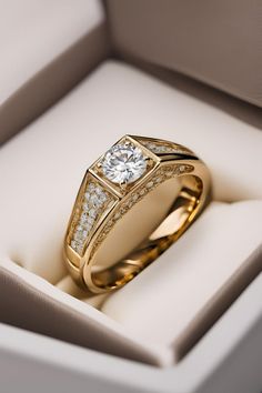 a diamond ring sits in a box on display