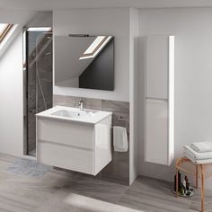 a bathroom with a sink, mirror and towel rack on the wall next to it