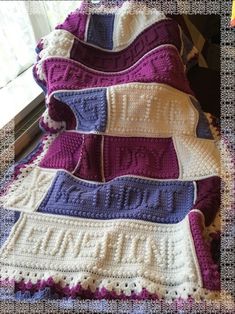 there is a crocheted blanket that looks like it has been made with yarn