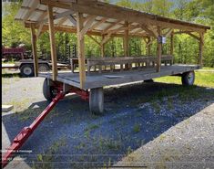 a trailer with a wooden structure attached to it