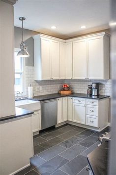 the kitchen is clean and ready for us to use it's new tile flooring