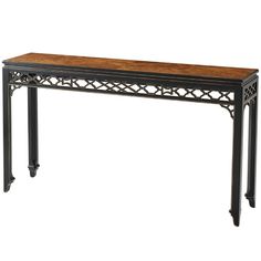 an ornate console table with wood top