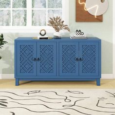 a blue cabinet in the corner of a room with a white rug on the floor