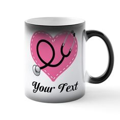 a black and white coffee mug with a pink heart and stethoscope on it