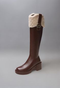 Stay warm and stylish in these winter boots. Expertly crafted with a square heel. convenient zip closure. and stylish belt buckle. they provide a chic. gothic look. Perfect for both casual and formal occasions. Brown High Boots, Brown Knee High Boots, Gothic Looks, Creative Background, Gothic Style, Brown Boots, Gothic Fashion, Belt Buckle, Accessories Bracelets