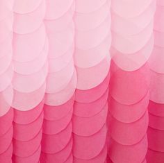 a pink and white wall with circles on it