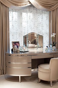 an elegant dressing table with mirror and stool