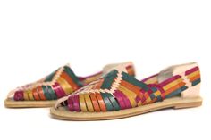 Women's Huarache Sandals - Multi #2 A colorful masterpiece -- handwoven to look stylish while keeping the authentic feel and look.  - Leather uppers - Slightly cushioned inner sole - Durable rubber outer sole - Closed Toe Artisan Multicolor Leather Sandals, Artisan Handmade Multicolor Huarache Sandals, Handmade Multicolor Huarache Sandals For Vacation, Artisan Multicolor Sandals For Festivals, Handmade Multicolor Closed Toe Huaraches, Multicolor Handmade Huaraches For Festival, Festival Multicolor Handmade Huaraches, Handmade Multicolor Festival Huaraches, Artisan Multicolor Huarache Sandals For Summer