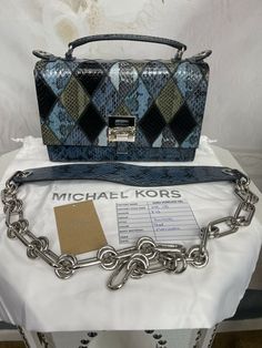 Michael Kors Collection Patchwork snakeskin Bancroft Bag. Shipped with USPS Priority Mail. Description This amazing bag is made of genuine snakeskin done in a diamond patched pattern! Stunning! Absolutely gorgeous...BRAND NEW! This Michael Kors collection bag was made in Italy by the finest artists, with the finest materials..... Don’t be the one carrying the average bag... get this top of the line bag at a HUGH DISCOUNT! Crafted in Italy from smakeskin and calf leather, the Bancroft shoulder ba Designer Blue Square Satchel, Designer Multicolor Rectangular Satchel, Designer Square Shoulder Bag With Silver-tone Hardware, Luxury Multicolor Satchel With Adjustable Strap, Designer Multicolor Shoulder Bag With Branded Hardware, Designer Multicolor Leather Satchel, Multicolor Rectangular Bag With Silver-tone Hardware, Designer Multicolor Leather Shoulder Bag, Diamond Patch