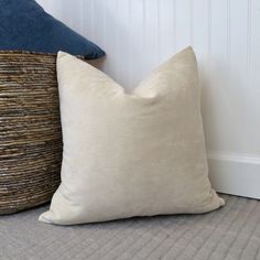 two pillows sitting next to each other on the floor