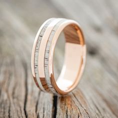 a wedding ring with wood inlays on it