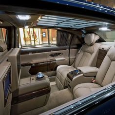 the interior of a luxury car is shown in this image, with no people inside