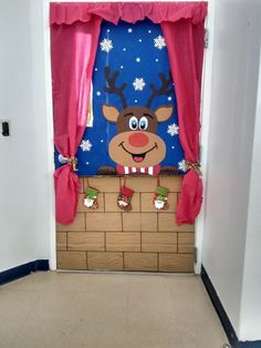 the door is decorated with a reindeer head and red scarfs on it's nose