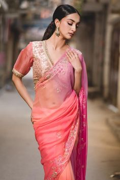 Peach, pink saree with floral, sequin, cutdana embroidery. Comes with unstitched blouse piece.
Components: 2
Pattern: Embroidered
Type Of Work: Floral
Fabric: Chiffon
Color: Pink, Peach
Other Details: 
Floral embroidery
Note: The stitched blouse worn by the model is not for sale
Occasion: Destination Wedding - Aza Fashions Peach Pink Saree, Cutdana Embroidery, Pink Chiffon, Pink Peach, Pink Saree, Floral Chiffon, Peach Pink, Sarees Online, Blouse Piece