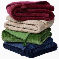 several blankets stacked on top of each other