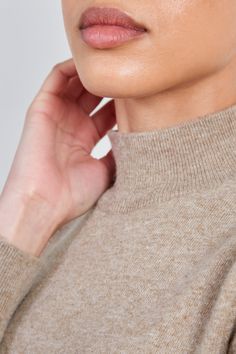 - Fit: True to size- Materials: 60% wool, 20% alpaca, 20% nylon- Thickness: Moderate- Sheerness: None- Stretch: None- Lining: None- Care: Dry clean or hand wash cold and dry in shade Beige Merino Wool Turtleneck For Fall, Winter Funnel Neck Mock Top For Layering, High Neck Merino Wool Tops For Layering, Fine Knit Beige Turtleneck For Fall, Beige Turtleneck Sweater For Layering, High Neck Merino Wool Tops For Fall, Fall Wool Tops With High Neck, High Neck Wool Top For Winter, Fall High Neck Wool Tops