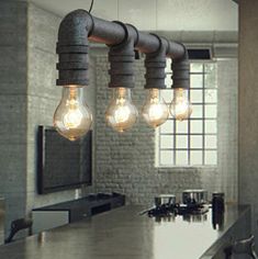 an industrial style light fixture hanging from the ceiling