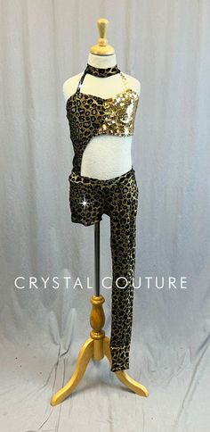 * Fun Black and Gold animal print bra-top and booties/legging decorated with Swarovski rhinestones and Gold metallic sequins. Leopard "spots" are an open net mesh. Nude lycra to and trunk are built-into the costume. * Accessories include: one long animal print fingerless glove and one Gold sequin wristlet glove. * WOW….10 gross Jet Hematite 12ss rhinestones! Fitted Sequin Bottoms For Dance, Baggy Clothing, Trio Costumes, Short Legging, Sequin Jewelry, Costumes Couture, Gold Animals, Printed Bras, Sequin Appliques