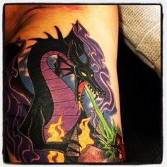 a man with a dragon tattoo on his arm