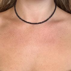 Black tourmline choker necklace made with 3mm faceted beads which give off a sparkle when catches the light.  14-16" adjustable  Protection  Grounding  Self control Aura Protection Other chokers available from the drop down menu. Can be a gift for loved ones, friends or a treat to yourself.   Comes in a gift bag. PER ORDER you will receive a complimentary crystal that will be chosen intuitively and an oracle card.  Instructions for how to cleanse and charge will also be included. Please note that due to the fact these are natural stones, the colours may vary but will be equally as beautiful. Feel free to contact us if you have any questions at all. We are happy to offer more information if required. Aura Protection, Necklace Minimalist, Self Control, Choker Necklaces, Black Tourmaline, Faceted Bead, Crystals And Gemstones, Crystal Healing, Gift Bag