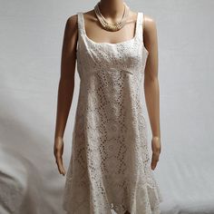 Item Detail: . Nwt .Women Dress/ Eyelet Embroidered Dress . Size 12 . Color Ivory . Sleeveless . Knee Lenght . Raffle Hem . Made In Usa Measurement: ( Garment Laying Flat Approx) . Armpit To Armpit 18" . Shoulder To Hem 37" See Image For More Detail Or Text Me If Any Question Smokepetfree Reasonable Offers Welcome! Fitted Cotton Lace Dress For Summer, Sleeveless Summer Mini Dress With Cutwork Hem, Summer Sleeveless Mini Dress With Cutwork Hem, Fitted Lace Sundress, Sleeveless Daywear Dresses With Cutwork Hem, Sleeveless Lace Mini Dress For Daywear, Spring Sleeveless Dress With Cutwork Hem, Sleeveless Dress With Cutwork Hem For Spring, Knee-length Lace Sleeveless Dress For Summer