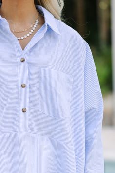 This striped blouse is the definition of classic and chic! Those colors are spot on for the season and we love that partial button down style. This blouse is going to look great with white skinnies and sandals or wedges for a very put together casual cute look. Partial button down collared neckline Long sleeves Striped print No stretch Poppy is wearing the small. Summer Vertical Stripes Button-up Blouse, Casual Vertical Stripes Button-up Blouse, Fitted Vertical Stripes Button-up Blouse, Striped Collar Button-up Blouse In Relaxed Fit, White Skinnies, Blue Striped Blouse, Blue Vertical Stripes Button-up Blouse, Mint Julep Boutique, Striped Blouse