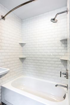 Bathroom Remodel with wall-mount sink, beveled subway tiles in the shower, mint green walls, and intricate tile floor design Beveled Tile Bathroom, Dream Restroom, Tile Around Tub, Bathtub Tiles, Bathtub Tile Surround, Beveled Subway Tile Backsplash, Bathroom 2022