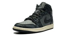 The Women’s Air Jordan 1 Mid “Distressed Smoke Grey” is a women’s-exclusive colorway of the lifestyle shoe with aged details.  The “Distressed Smoke Grey” features a Smoke Grey leather base with Off Noir suede overlays that have a crackled treatment to appear weathered.  A grey “Wings” logo appears on the collar, while Jumpman branding is found on the tongue tag.  Jordan Brand supplies the shoe with a Sail rubber midsole for a decidedly vintage look.  Release date: January 20, 2024 Grey Jordans, Wings Logo, Stadium Goods, January 20, Grey Shoes, Air Jordan 1 Mid, Jordan 1 Mid, Air Jordan 1, Grey Leather