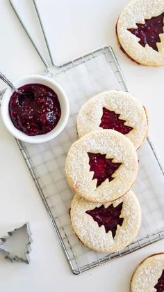 cookies with jam are on a cooling rack