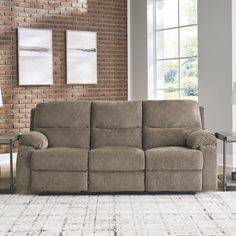 a living room scene with focus on the reclining sofa