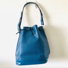 Louis Vuitton Petit Noe Blue Epi Leather Shoulder Bag. Purchased From Consignment, I Never Used It. Minor Imperfection On Strap, Bottom Of Bag And Brass On Buckle. Normal Wear On Finishing Of Trim(Waxed Area). Retail $1,900 Date Code Ar0934 Designer Blue Bucket Bag, Luxury Blue Bucket Bag With Adjustable Strap, Designer Blue Bucket Bag With Dust Bag, Luxury Blue Shoulder Bucket Bag, Luxury Blue Bucket Bag For Daily Use, Luxury Blue Bucket Bag For Shopping, Luxury Blue Bucket Bag, Luxury Blue Bucket Bag With Gold-tone Hardware, Designer Blue Bucket Bag For Travel