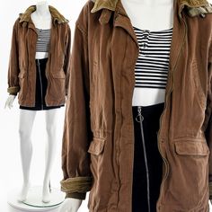 "- 70s/80s brown chore coat - corduroy and flannel detail - double pockets on front - metal zipper front closure - flannel lining - hidedn inside pocket - hood attached Fits like:  S - M Material:  Cotton Condition:  Great Clipped on Mannequin:  No ✂ SIZE + FIT ✂ Length: 30\" / 76 cm Shoulders, seam to seam: 20\" / 51 cm Sleeve Length: 23\" / 58 cm Bust: 42\" / 107 cm Waist: 44\" / 112 cm All measurements are taken with garment lying flat. ALWAYS refer to measurements as vintage sizes run can vary greatly from today's modern sizes. We recommend comparing measurements above with a similar style garment you own for best fit before purchasing.  DRESS FORM / MANNEQUIN is wearing the size detailed above but she typically measures a size 4/6 by modern retail sizes or a general size small. Belt A Brown Cotton Utility Jacket For Winter, Vintage Cotton Hooded Jacket For Fall, Brown Cotton Hooded Jacket For Fall, Retro Hooded Jacket With Pockets For Fall, Brown Utility Parka For Winter, Brown Cotton Parka For Fall, Brown Utility Outerwear With Corduroy Collar, Brown Fall Parka With Pockets, Brown Utility Jacket With Corduroy Collar