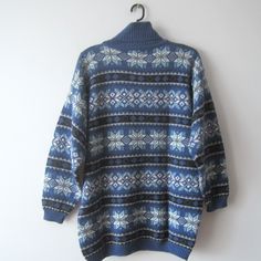 "Vintage Unisex Winter Holidays Sweater Ugly Party Turtleneck Jumper Knit Snowflake Pullover Blue Retro Sweater Christmas Jumper Size M/L Estimated size: Mens M; Women's L Measurements: (lying flat) Length - 28.5\"/ 72.5 cm Pit to pit: 22\"/ 56 cm Waist: 21.5\"/ 54.5 cm Shoulder: 22\"/ 56 cm Sleeve: 19\"/ 48 cm Please check measurements to insure a proper fit. Remember to allow yourself some extra room for movement. You can compare these with something from your closet that fits you well. This s Blue Crew Neck Cardigan For Winter, Blue Turtleneck Sweater For Winter, Blue Christmas Holiday Sweater, Blue Fair Isle Sweater For Cold Weather, Vintage Blue Sweater With Fair Isle Pattern, Blue Vintage Sweater With Fair Isle Pattern, Vintage Blue Fair Isle Sweater, Nordic Blue Crew Neck Sweater, Blue Nordic Crew Neck Sweater