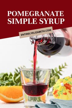 red wine being poured into a glass with oranges in the background and text overlay that reads pomegranate simple syrup