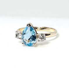 "𝗪𝗔𝗡𝗧 𝟭𝟬% 𝗢𝗙𝗙 𝗧𝗢𝗗𝗔𝗬? Get your code at https://bit.ly/2Jlkfoz (Just copy and paste that into your browser.). --------------------------------------------------------------- Amazing blue topaz solitaire ring framed with sparkling diamonds, which will look spectacular on your finger and bring you unending joy. All eyes will definitely be on you! The blue topaz is pear shaped, set in a dainty 14k yellow gold basket prong setting and surrounded by tiny diamonds. The band is half round, Gold Basket, Handmade Wedding Rings, Pear Shaped Ring, Victorian Rings, Precious Jewels, Midi Rings, Tiny Diamond, Handmade Wedding, Sparkle Diamonds