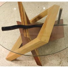 a glass table topped with a wooden object