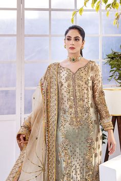 Long Kameez Trouser Embellished Pakistani Wedding Dress is a beautiful masterpiece that will give you a beautiful look on the big day. Luxury designs and hand-crafted details of ornaments make this beautiful Pakistani Embroidered Dress an epitome of beauty. Embellished Kameez: The beautiful kameez has an alluring golden color. The kameez is gracefully emblazoned with embroidery. Goldwork and intricate designs make this beautiful long kameez a perfect choice to wear on the wedding. Embellished bo Long Kameez, New Baby Dress, Pakistani Bridal Dress, Ugly Outfits, Bridal Dupatta, Pakistani Designer Clothes, Desi Wedding Dresses, Embellished Shirt, Pakistani Wedding Dress