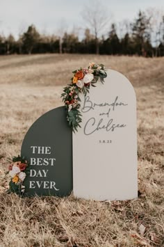 a couple of graves sitting on top of a grass covered field