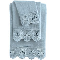 two blue towels with white lace trims on the edges and one has an openwork design